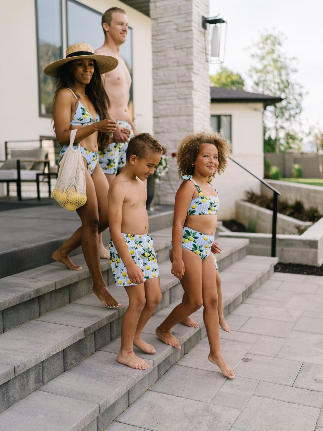 Navalora Swim Boy's Amalfi Coast Inspired Lemon Swim Shorts, Family Wearing Matching Swimsuits Lifestyle Image