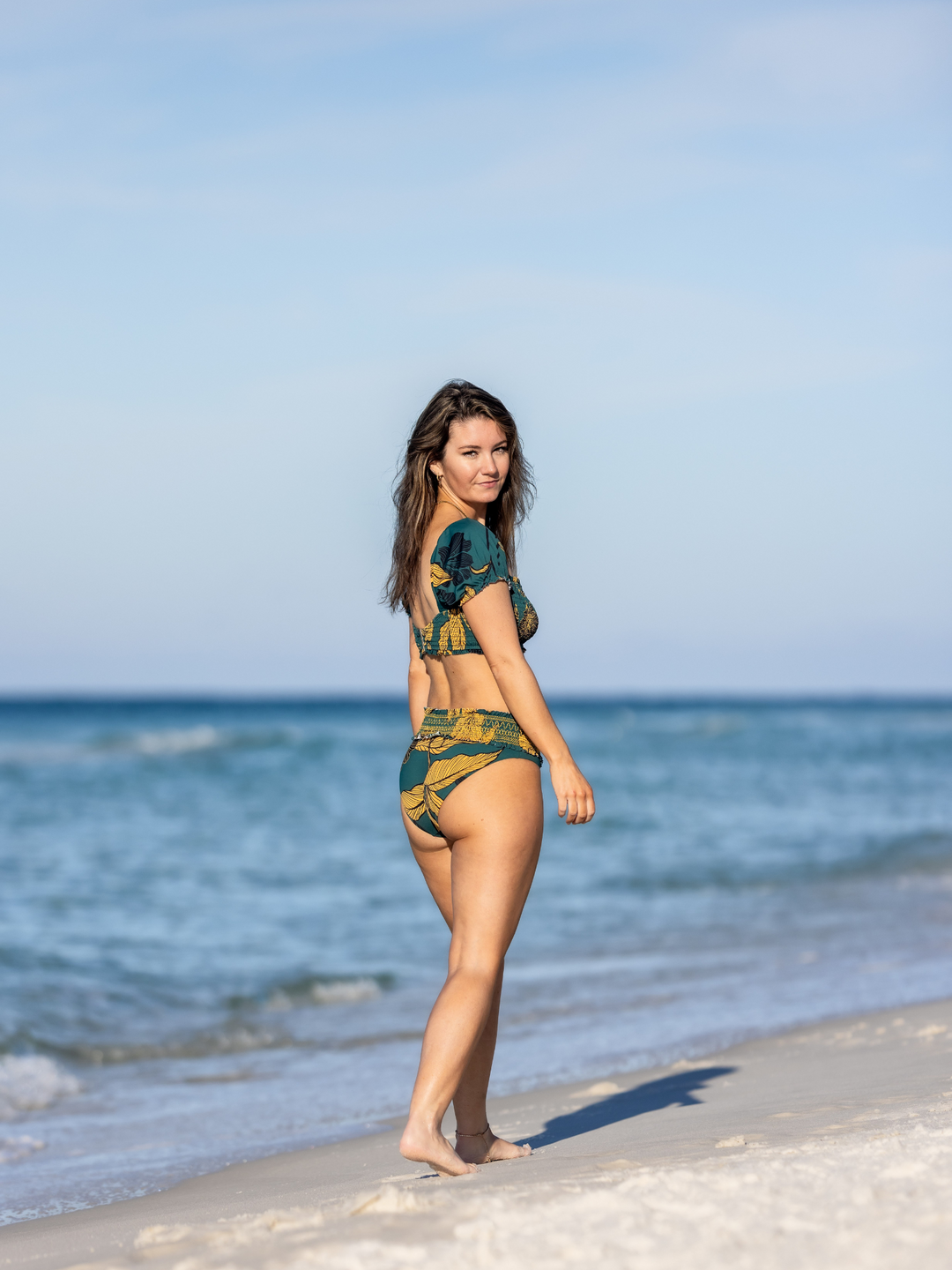 Women's Emerald Enchantment Smocked Waist Bikini Bottom – women's swimwear, worn by woman on the beach in Florida, Side and Back View