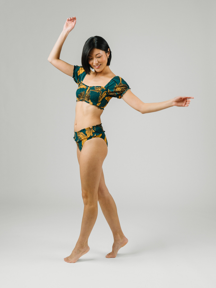 Women's Emerald Enchantment Underwire Bikini Top with Sleeves – women's swimwear, Worn by a model in studio side view
